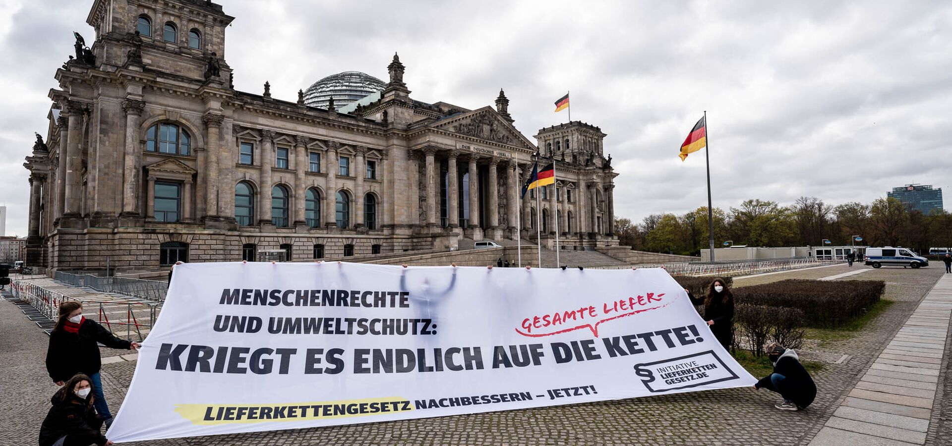 Protest action by the Supply Chain Act Initiative in front of the German parliament. Human rights and environmental protection are on the banner: finally get it on the entire supply chain! Improve the Supply Chain Act now!